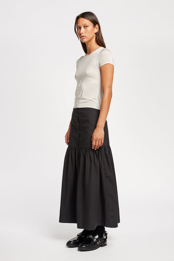 Front view on model of the off white Convoy fitted short sleeve top with crew neckline, crafted in soft sheen recycled poly fabric