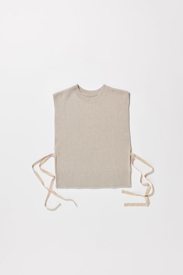 Cusp Knit Vest in dove grey, flat front, featuring herringbone ties and half-cardigan knit construction.