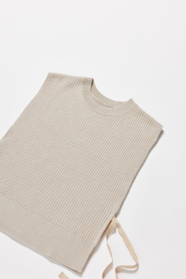 Close-up of Cusp Knit Vest showing herringbone tie and half-cardigan stitch texture.