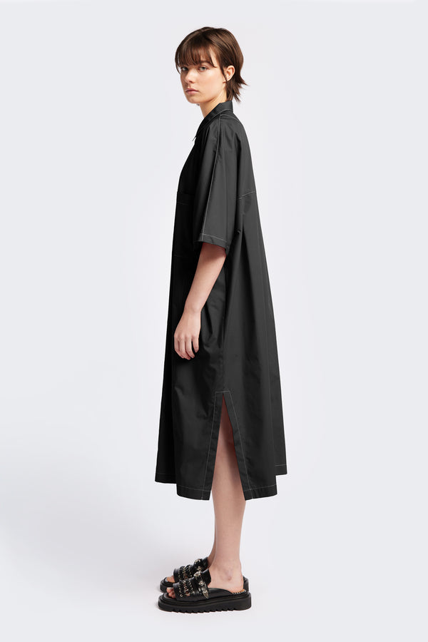 The Daily Dress is a midi-length, oversized and relaxed dress with wide, elbow grazing sleeves and tall side slits for ease of movement. Made from an all natural-cotton in Black. 