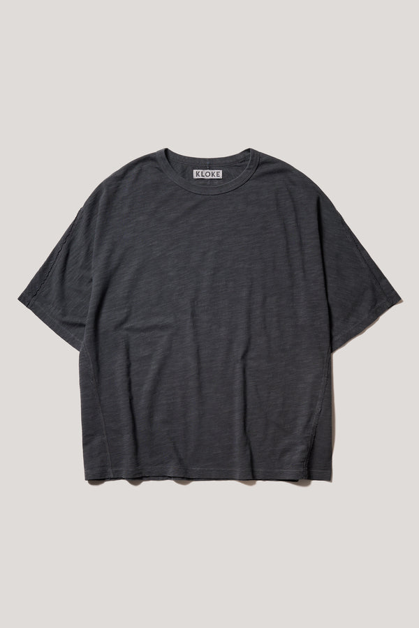 Flat front of the Jet Balck Declare Tee in pigment-dyed slub cotton with relaxed boxy fit 