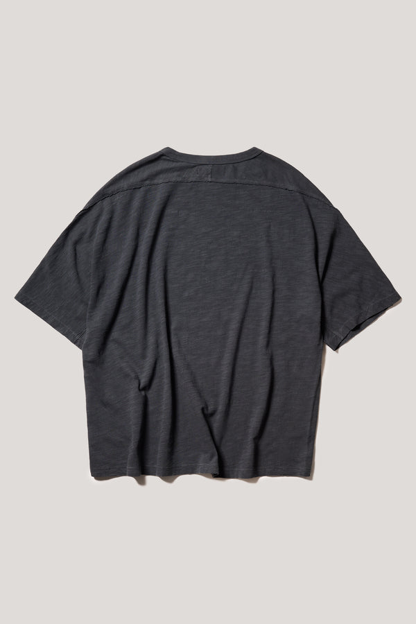 Flat back of the Jet Black Declare Tee in pigment-dyed slub cotton with relaxed boxy fit 