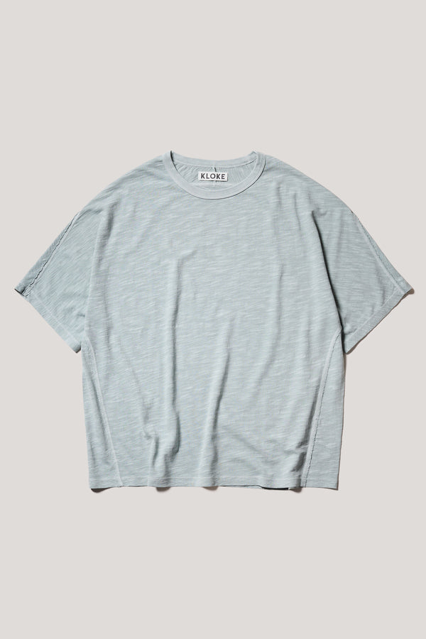 Flat Front of the Pale Blue Declare Tee in pigment-dyed slub cotton with relaxed boxy fit 
