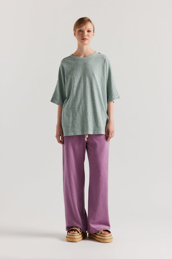 Front view of model in the Pale Blue Declare Tee in pigment-dyed slub cotton with relaxed boxy fit