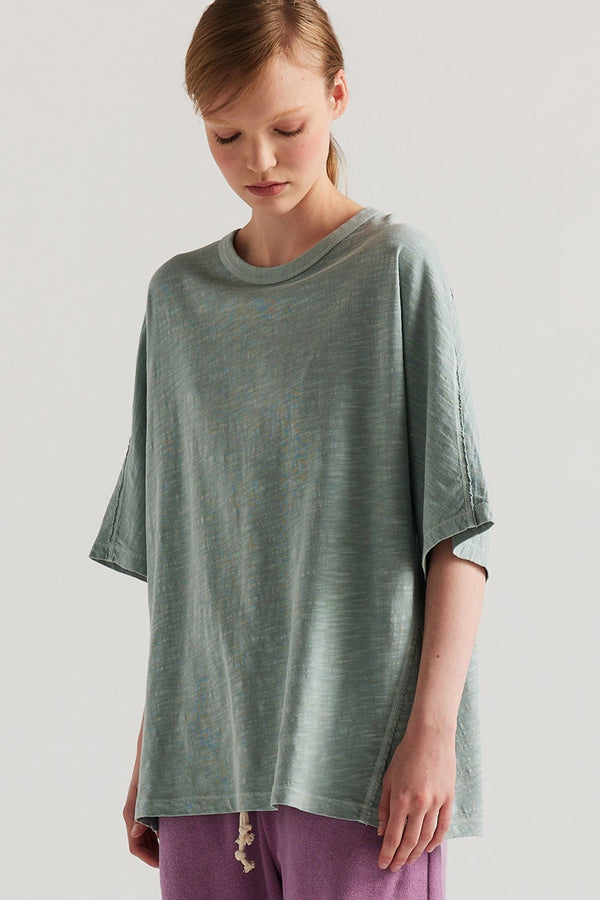 Front view of model in the Pale Blue Declare Tee in pigment-dyed slub cotton with relaxed boxy fit 