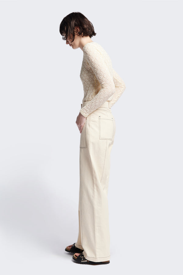 Side view of the Delta pant in Ecru Beige, a tailored casual pant in premium cotton herringbone twill with contrast stitch panelling. Straight leg and tailored fit for a sleek, flattering polished finish. Available in 6 sizes. 