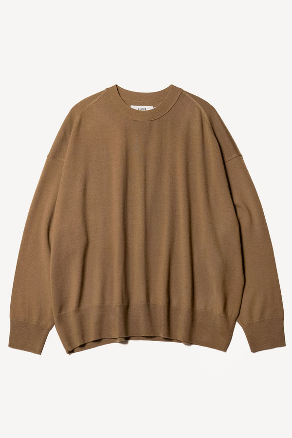 Flat Front view of the Descend Loose Fit Merino Knit in brown, a relaxed-fit merino wool sweater with a crew neck. 