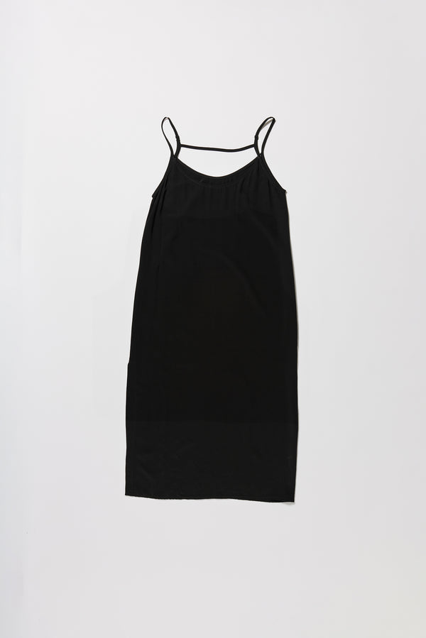 Flat back of black Mid-length slip dress with straight neckline and relaxed silhouette