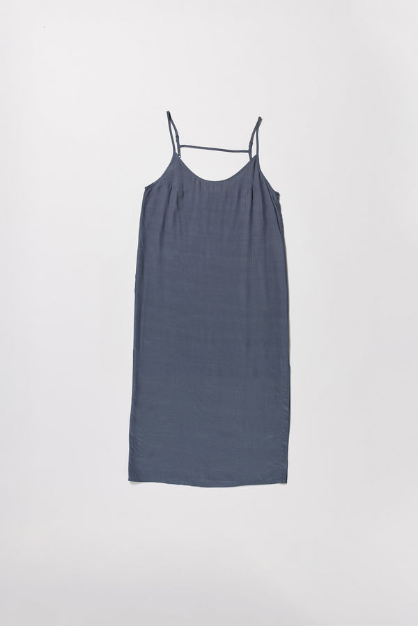 Flat front of indigo blue Mid-length slip dress with straight neckline and relaxed silhouette