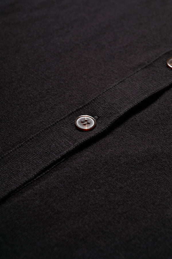 Close up fabric shot of the Escalade Knit Shirt in Black, a relaxed knit short sleeve shirt with a button placket and straight collar, made from premium soft, summer-weight combed cotton. Textured knit construction, available in 5 sizes.