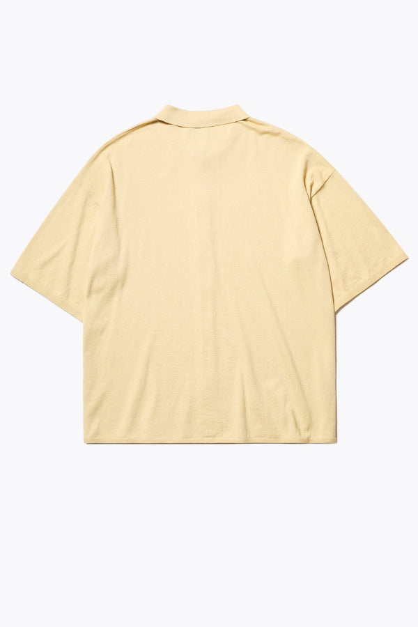 The back of the Escalade Knit Shirt in Butter Yellow, a relaxed knit short sleeve shirt with a button placket and straight collar, made from premium soft, summer-weight combed cotton. Textured knit construction, available in 5 sizes.