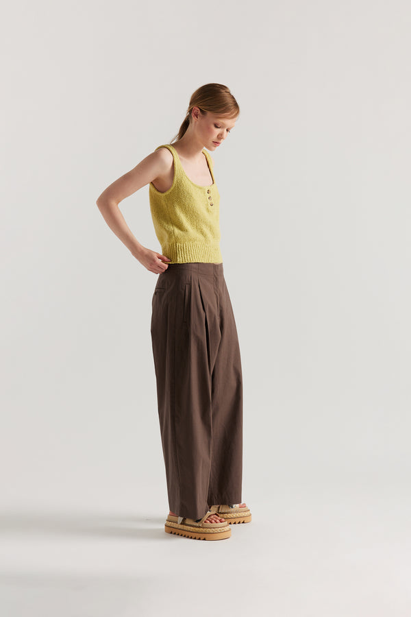 Side of Model in the Citrus Yellow Ether Rib Tank with wide straps, scoop neckline and three-button front detail.