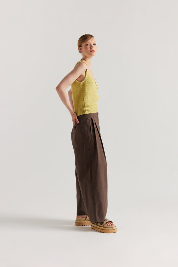Side of Model in the Citrus Yellow Ether Rib Tank with wide straps, scoop neckline and three-button front detail.