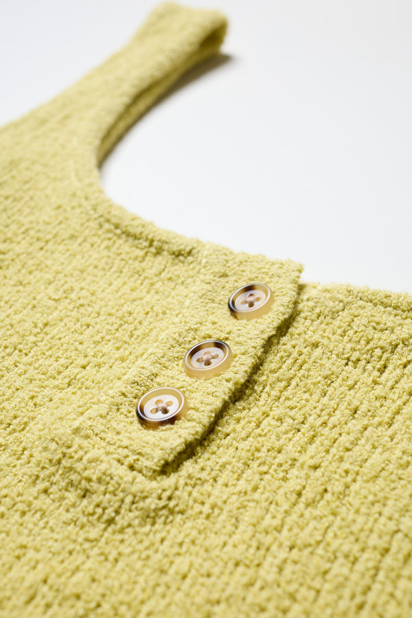 Close-up of the Citrus Yellow Ether Rib Tank’s rib knit texture and centre-front buttons.
