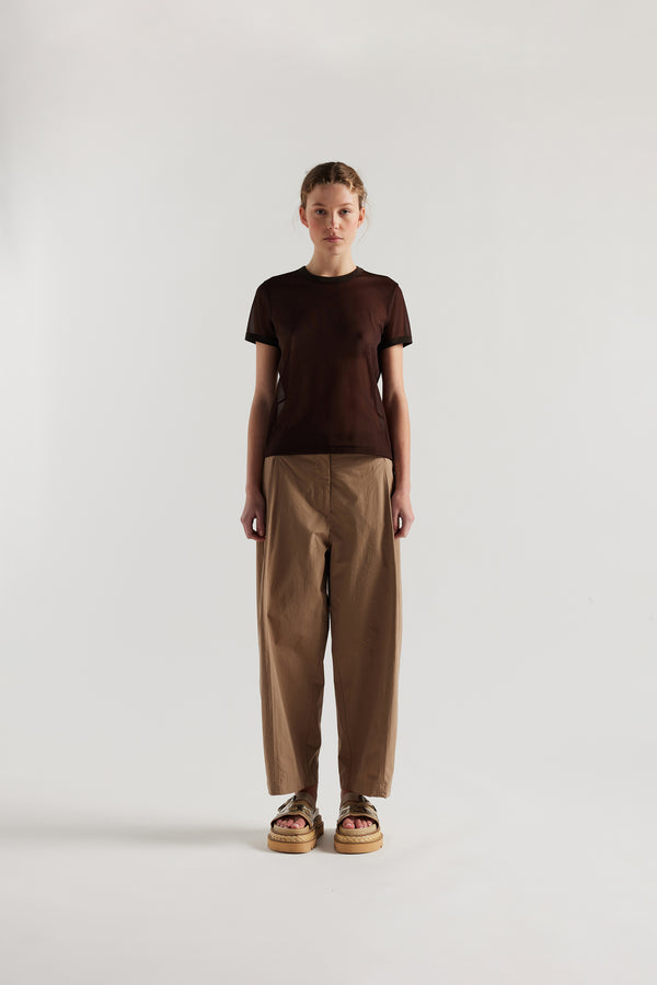 Front view on female model of the slim-fit sheer knit tee with ringer neckline in brown. 