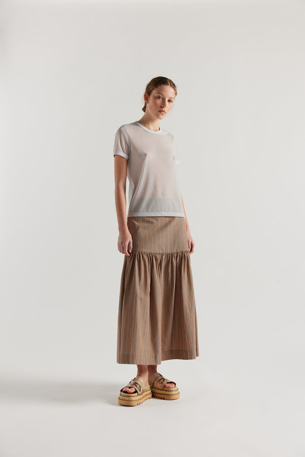 Front view on female model of the slim-fit sheer knit tee with ringer neckline in Pale Blue. 