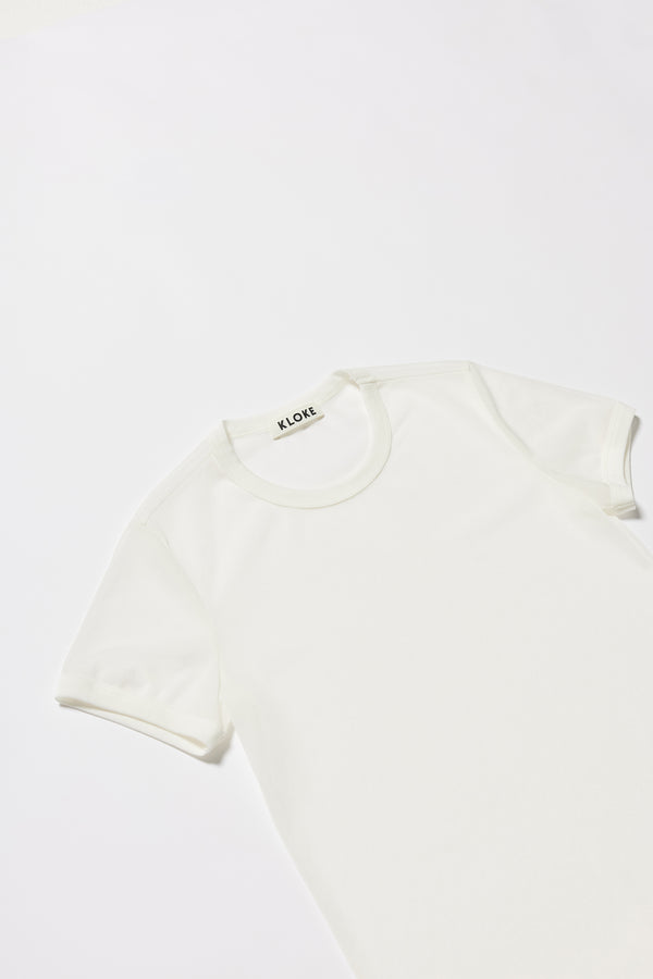 Close-up of ribbed binding at neckline and armholes. The Ethereal Tee in White