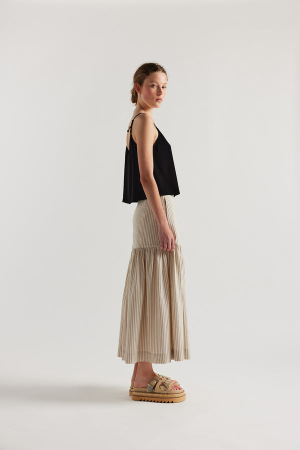 Side view on model of black Viscose rayon Evolve Top with adjustable straps and fluid drape