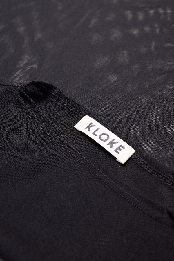 Close-up of the Exist Top’s Japanese power-mesh texture and fine detailing in Jet Black