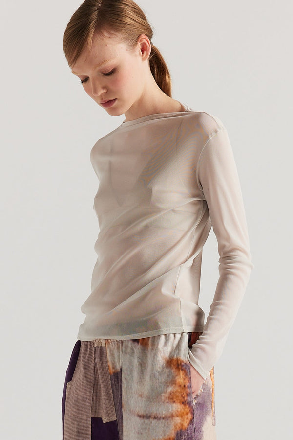 Front of Model wearing the Bone Cream Exist Top in sheer Japanese power-mesh with a clean, fitted silhouette. 