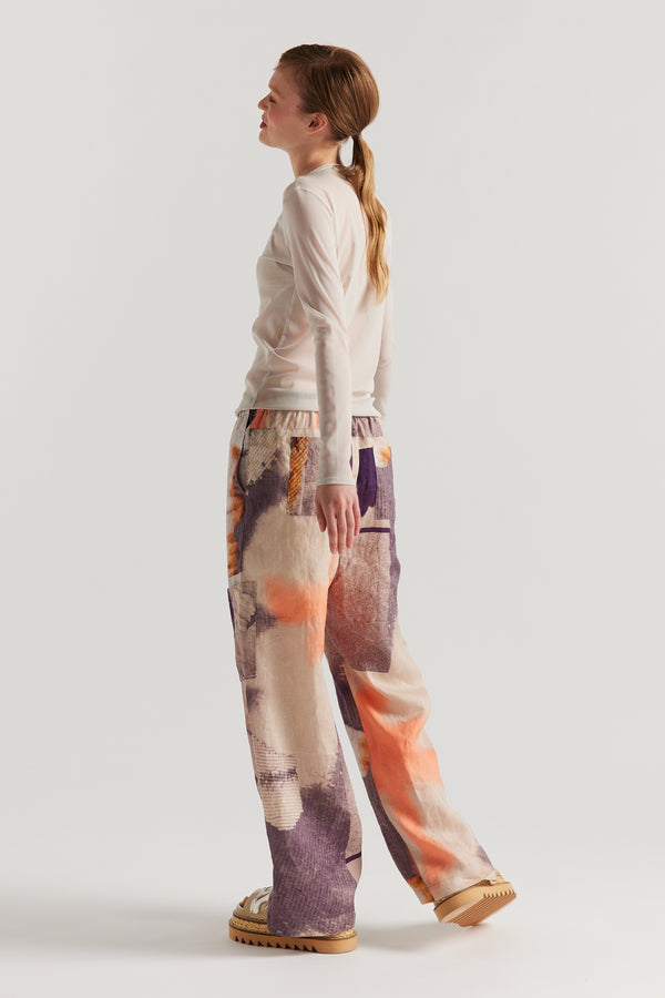 Back of Model wearing the Bone Cream Exist Top in sheer Japanese power-mesh with a clean, fitted silhouette. 