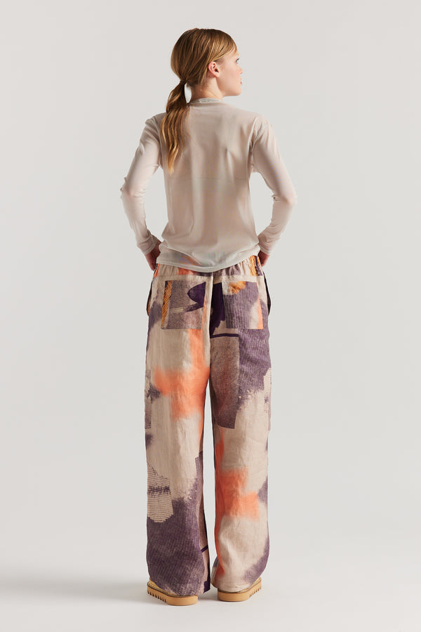 Back of Model wearing the Bone Cream Exist Top in sheer Japanese power-mesh with a clean, fitted silhouette. 