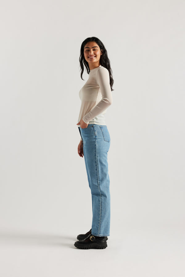 Side of Female Model wearing the Ecru Exist Top in sheer Japanese power-mesh with a clean, fitted silhouette. 