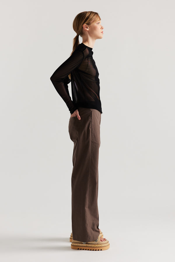 Side of Model wearing the Jet Black Exist Top in sheer Japanese power-mesh with a clean, fitted silhouette. 