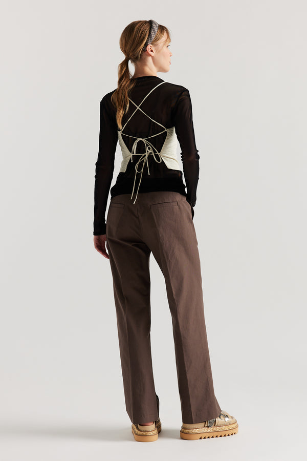 Back of Model wearing the Jet Black Exist Top in sheer Japanese power-mesh with a clean, fitted silhouette. 