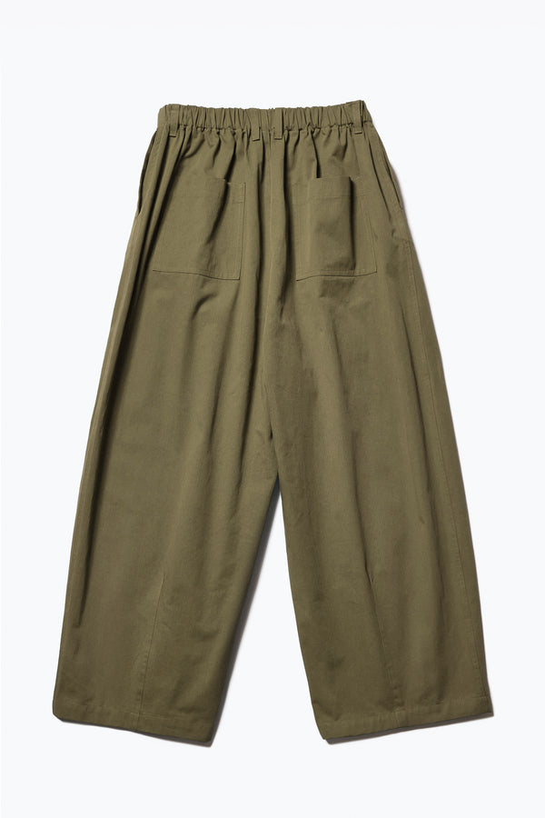 Flat Back view of the Factor Pleat Pant Olive Green. A relaxed silhouette defined by an encased elastic waistband. 