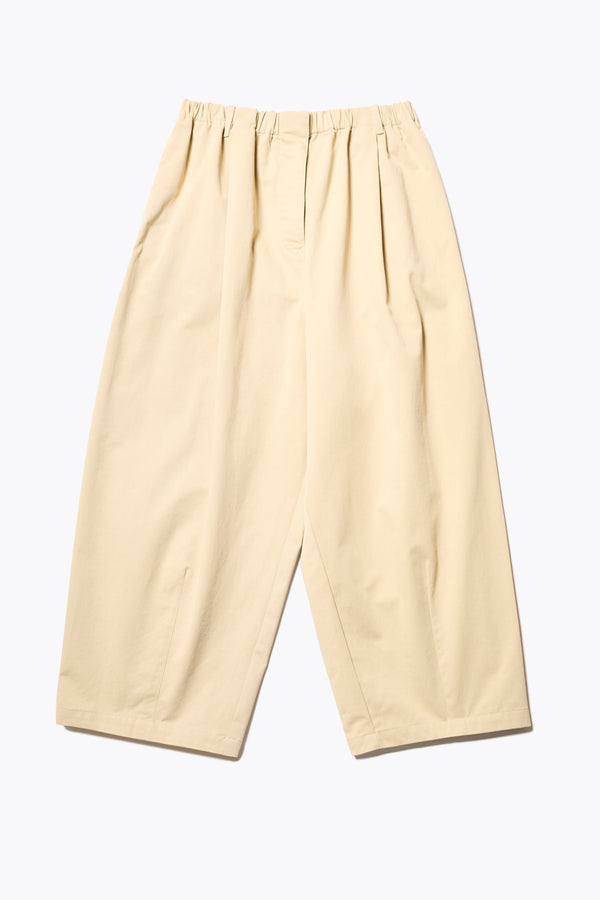 The Factor Pleat Pant in Sand Yellow. A relaxed-fit pants with an encased elastic waistband, darted hem detail, side entry pockets, and back patch pockets. Comfortable and perfect for summer. Available in 6 sizes. 