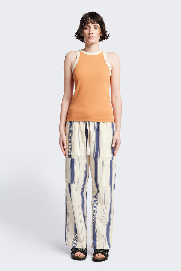 Front of Kloke Flux Racer Back Tank in Pastel Orange and Ecru Japanese ribbed cotton, featuring a slim fit and slight racer neckline, perfect for layering. Available in 5 sizes. 