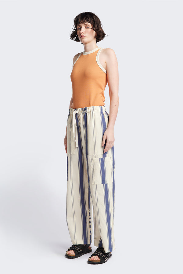 Front of Kloke Flux Racer Back Tank in Pastel Orange and Ecru Japanese ribbed cotton, featuring a slim fit and slight racer neckline, perfect for layering. Available in 5 sizes. 