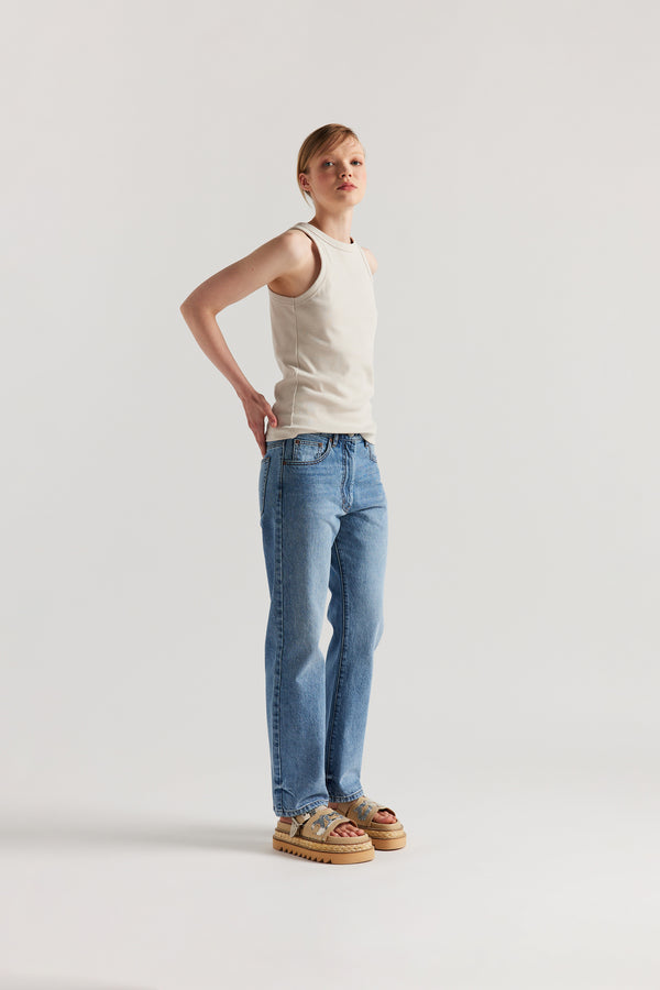 Front of Model wearing slim-fit Japanese ribbed cotton racer-back tank in Bone Off White