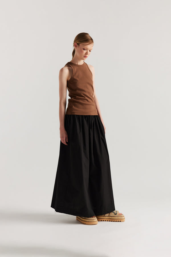 Front of Model wearing slim-fit Japanese ribbed cotton racer-back tank in Cocoa Brown