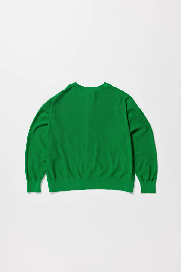 Flat back of the green cotton ribbed sweater with button closure and dropped shoulders.