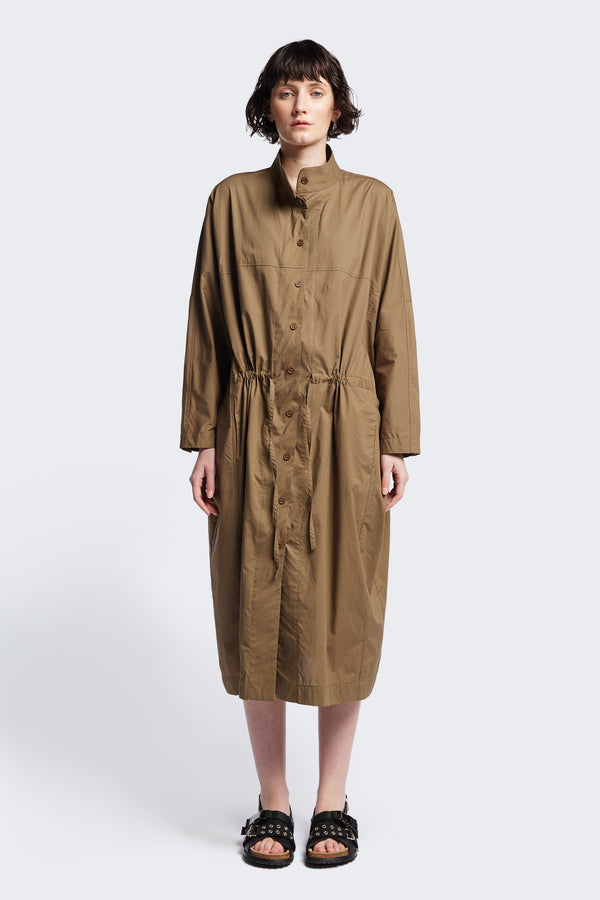 Front of the Olive Brown Iberia Dress, an oversized day dress with loose sleeves and underarm gusset detail, featuring adjustable ties at the front and back for a cinched waist or relaxed fit.