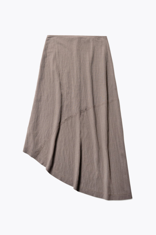 Flat Front of The in time skirt in Taupe brown, an Asymmetrical skirt with panelled detailing, subtle layered effect, and raw hemline, designed to elongate the figure with a flattering waist fit.