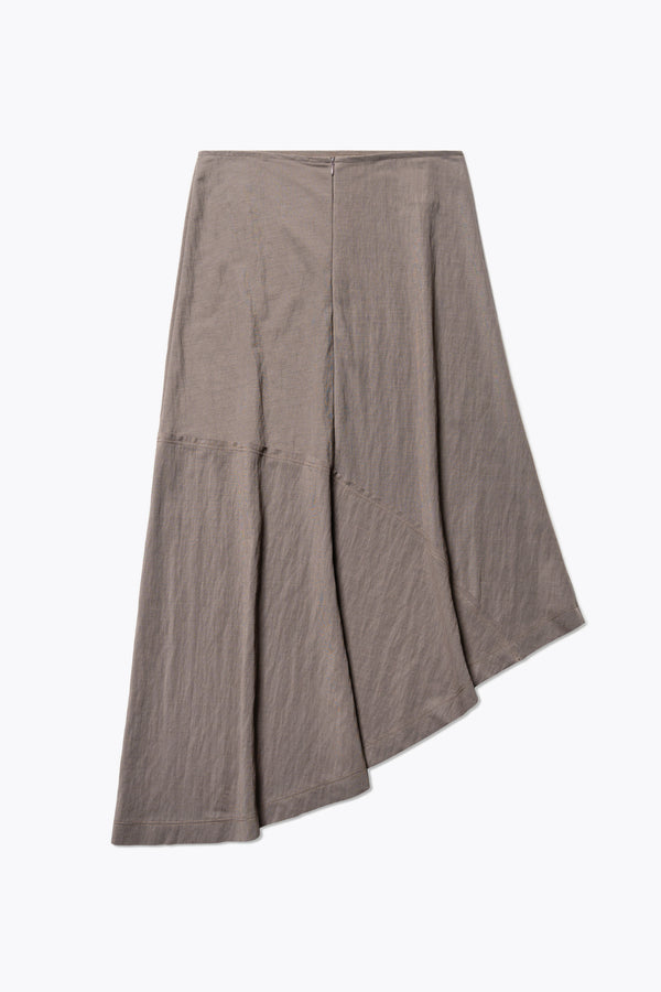 Flat back of The in time skirt in Taupe brown, an Asymmetrical skirt with panelled detailing, subtle layered effect, and raw hemline, designed to elongate the figure with a flattering waist fit.