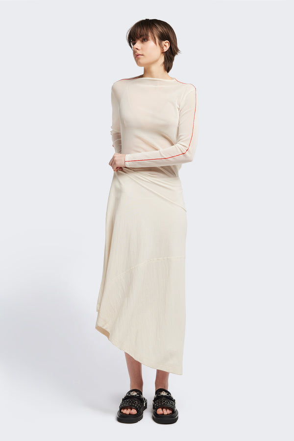 Front of The in time skirt in Ecru, an Asymmetrical skirt with panelled detailing, subtle layered effect, and raw hemline, designed to elongate the figure with a flattering waist fit.