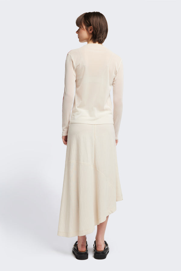 Back of The in time skirt in Ecru, an Asymmetrical skirt with panelled detailing, subtle layered effect, and raw hemline, designed to elongate the figure with a flattering waist fit.