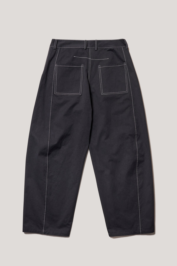 Flat back of the Initial dart pant in black, a tailored cotton style in sand with contrast-stitch front seam panelling.