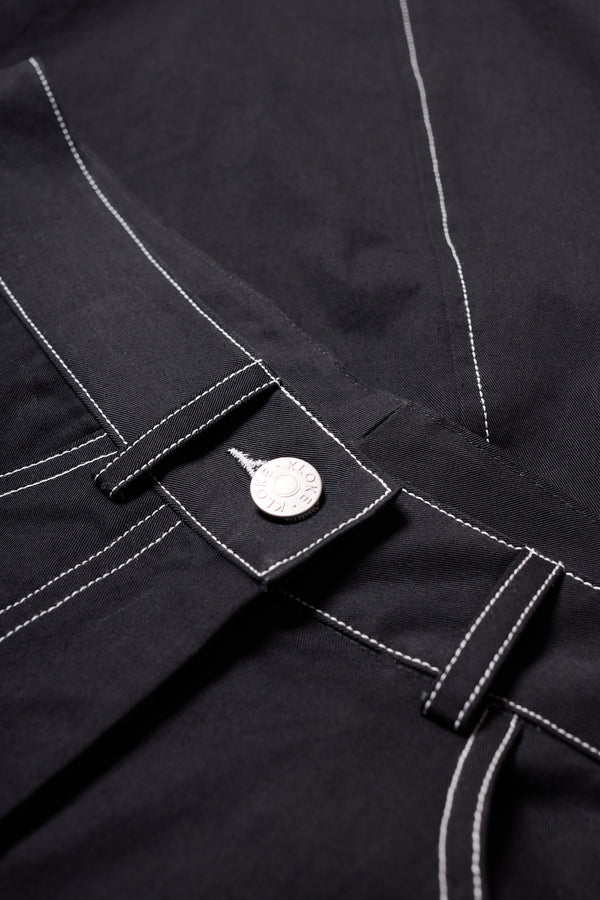 Close-up of contrast stitching + Fabric of the black Initial Dart Pant