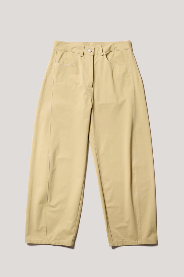 Flat front of the Initial dart pant a tailored cotton style in sand with contrast-stitch front seam panelling.