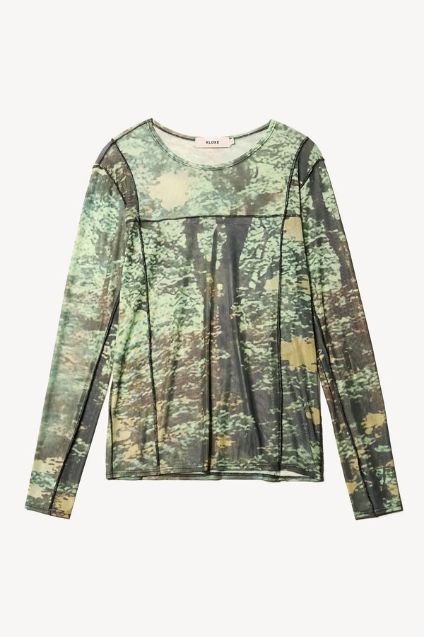 Flat Front view of the Inlet Top in Real Tree green print, featuring a slim fit, semi-sheer mesh fabric, and black baby lock stitching.