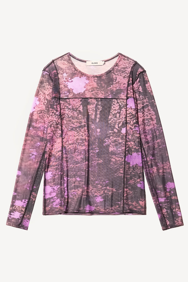 Flat Front view of the Inlet Top in Real Tree purple print, featuring a slim fit, semi-sheer mesh fabric, and black baby lock stitching.