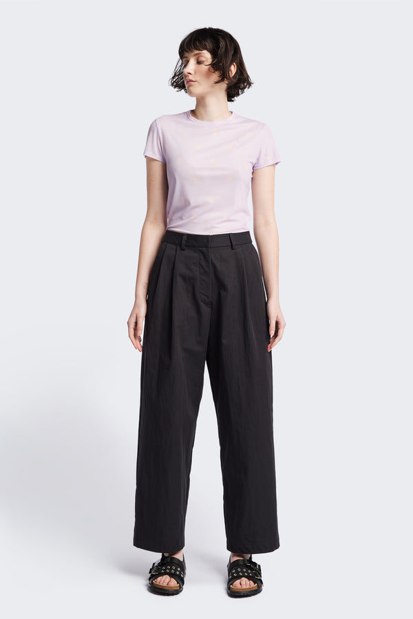 The Interim Pant in Black, Tailored wide-leg in premium cotton with double-front pleats, side slant pockets, jet back pockets, and a hook-and-bar closure. Available in 6 sizes.