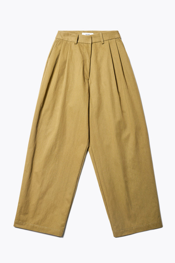 The Interim Pant in Olive Brown, Tailored wide-leg in premium cotton with double-front pleats, side slant pockets, jet back pockets, and a hook-and-bar closure. Available in 6 sizes.