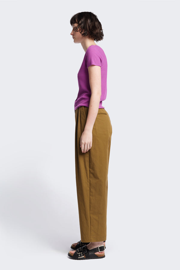 Side of The Interim Pant in Olive Brown, Tailored wide-leg in premium cotton with double-front pleats, side slant pockets, jet back pockets, and a hook-and-bar closure. Available in 6 sizes.