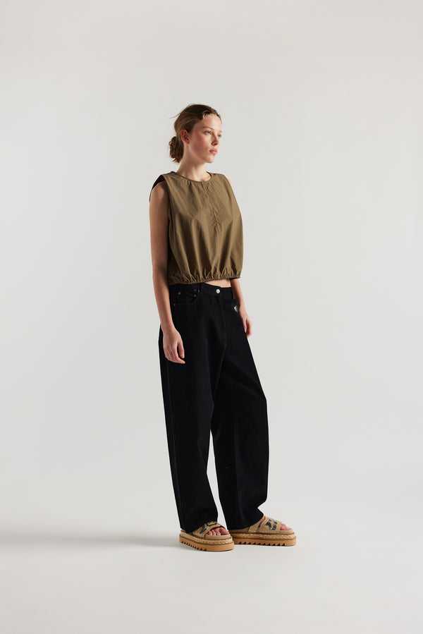 Front  view of female model in the Olive Lambent Top front view showing round neckline and centre-front seam detail
